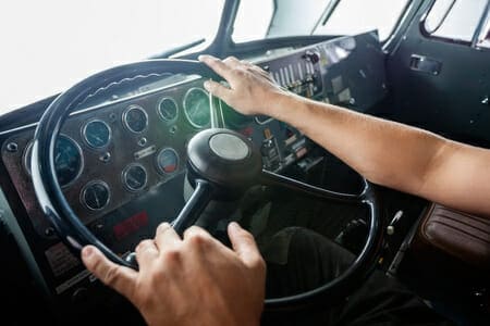 Truck Driver Holding a Steering Wheel