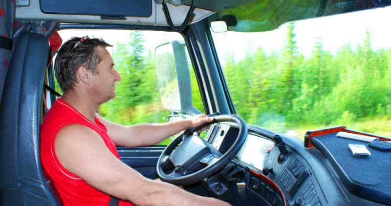 The driver at the wheel of the truck